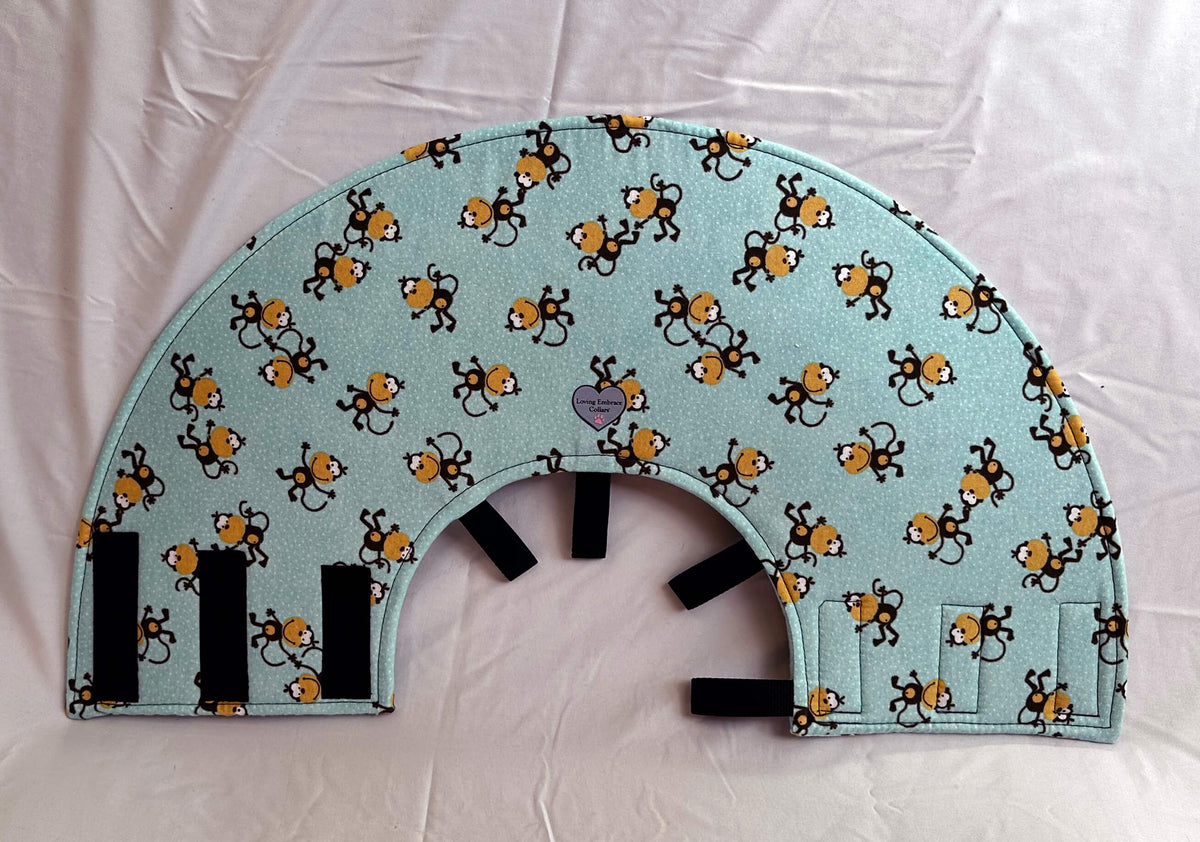 Soft Dog cone in monkey print flannel fabric with adjustable Velcro closure.